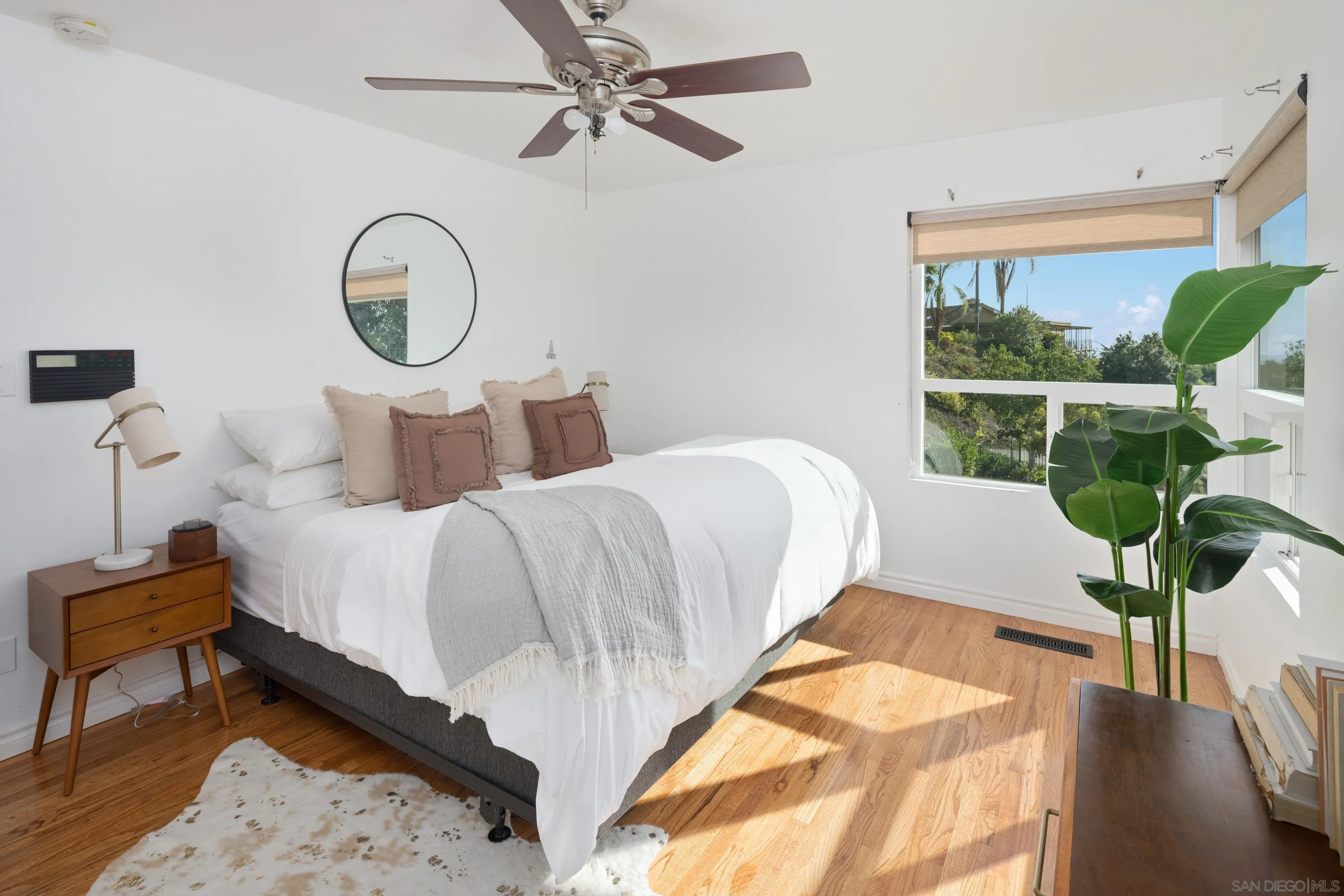 9560 Starlight Lane La Mesa, CA 91941 - Photo 8 of 18 a bed room with a bed lamp closet and large window