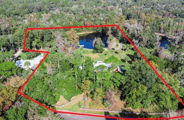 a view of a lake with sitting area