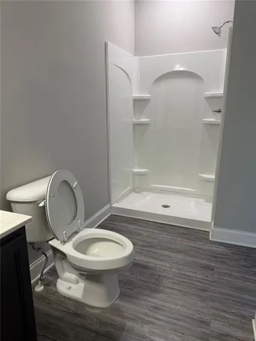 a bathroom with a sink a toilet and bathtub