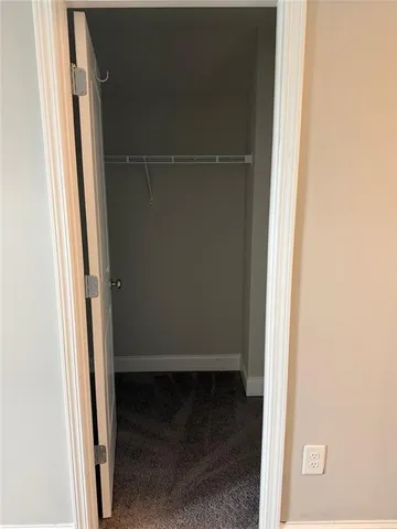 a view of an empty room with a large window