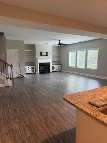 a view of living room with furniture and fireplace