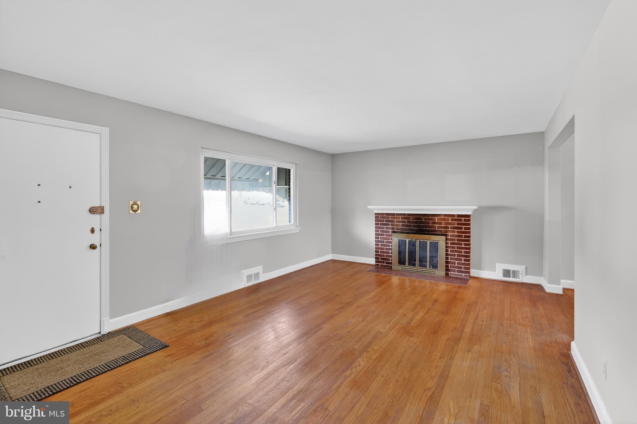 6001 Dinwiddie Street Springfield, VA 22150 - Photo 11 of 42 a view of empty room with wooden floor and fan