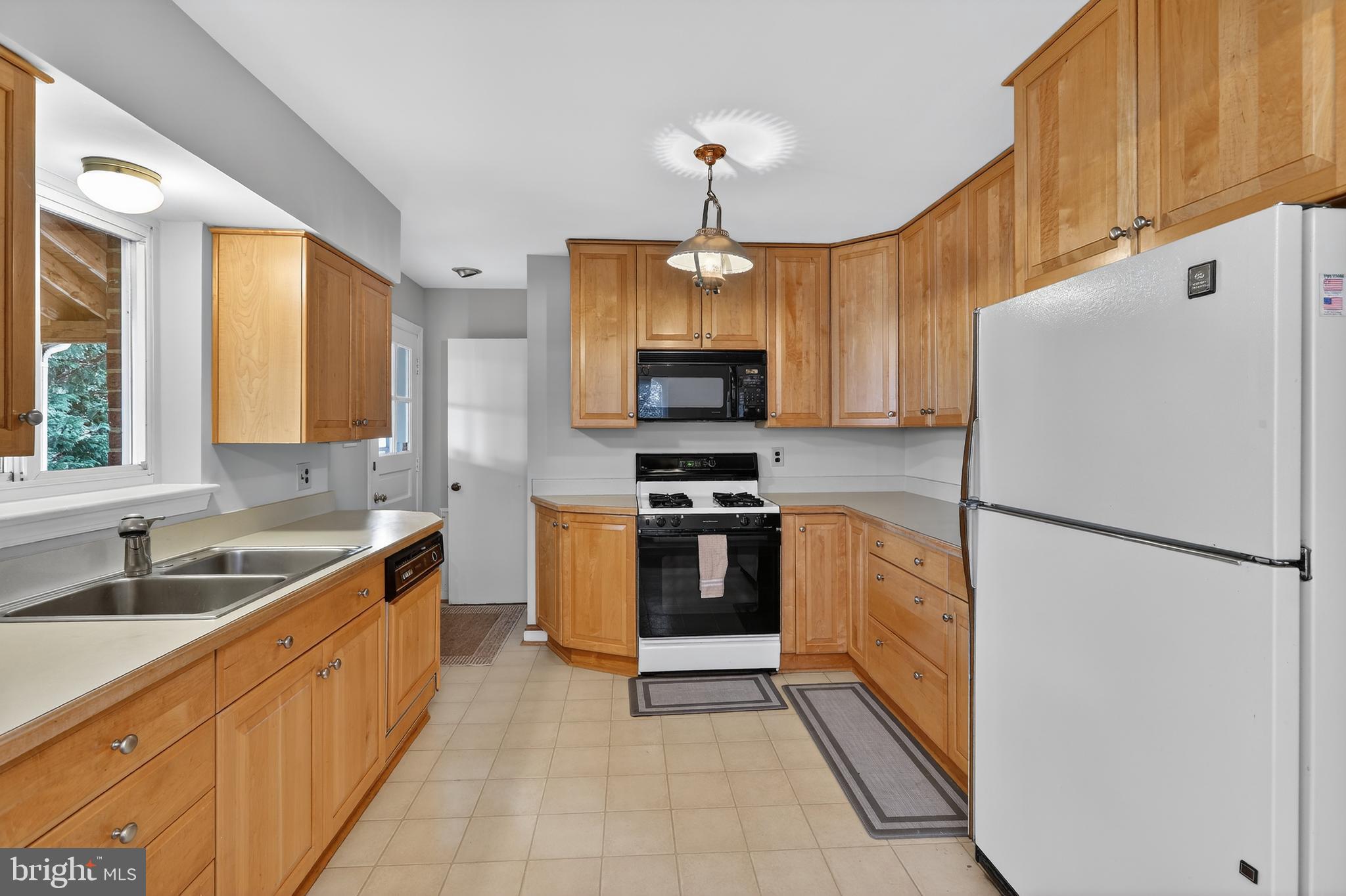6001 Dinwiddie Street Springfield, VA 22150 - Photo 3 of 42 a kitchen with granite countertop a refrigerator and a sink