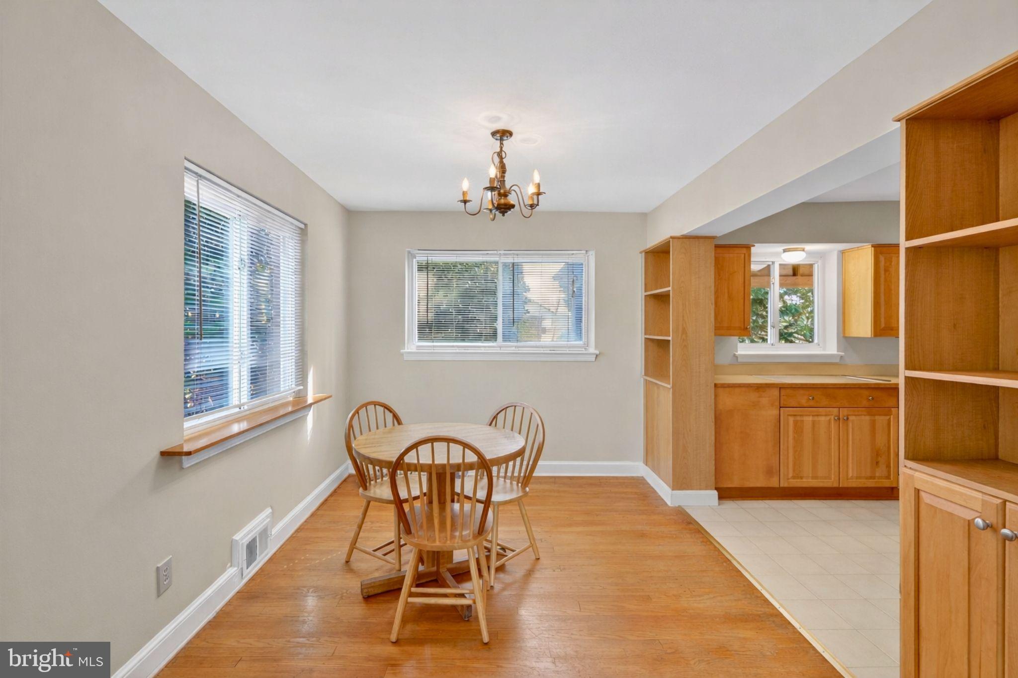 6001 Dinwiddie Street Springfield, VA 22150 - Photo 6 of 42 a view of a dining room with furniture window and wooden floor