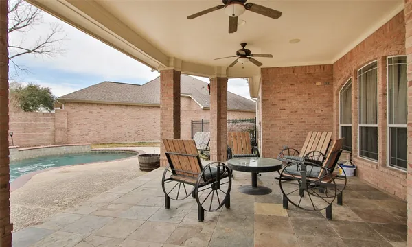 a view of a chairs and table in a patio