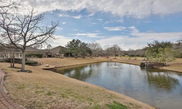 a view of a house with yard and sitting area
