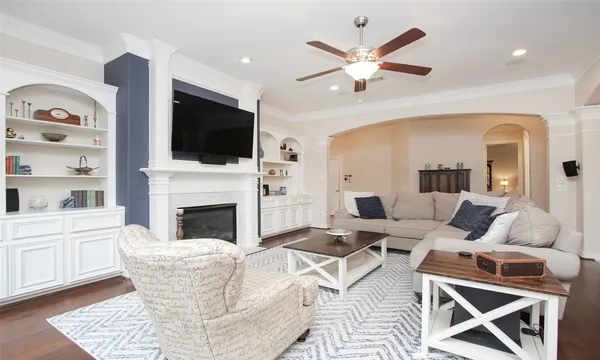 a kitchen with stainless steel appliances granite countertop a sink dishwasher a stove a refrigerator with a dining table and chairs