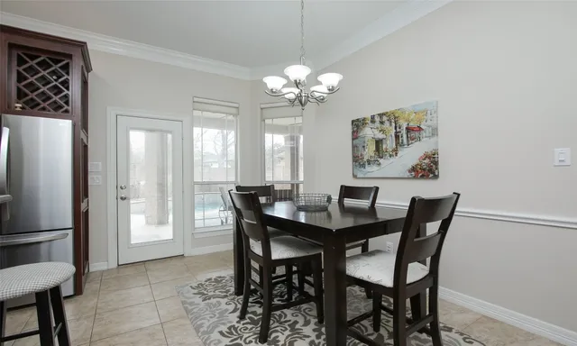 a kitchen with granite countertop stainless steel appliances a sink dishwasher stove top oven and cabinets with wooden floor