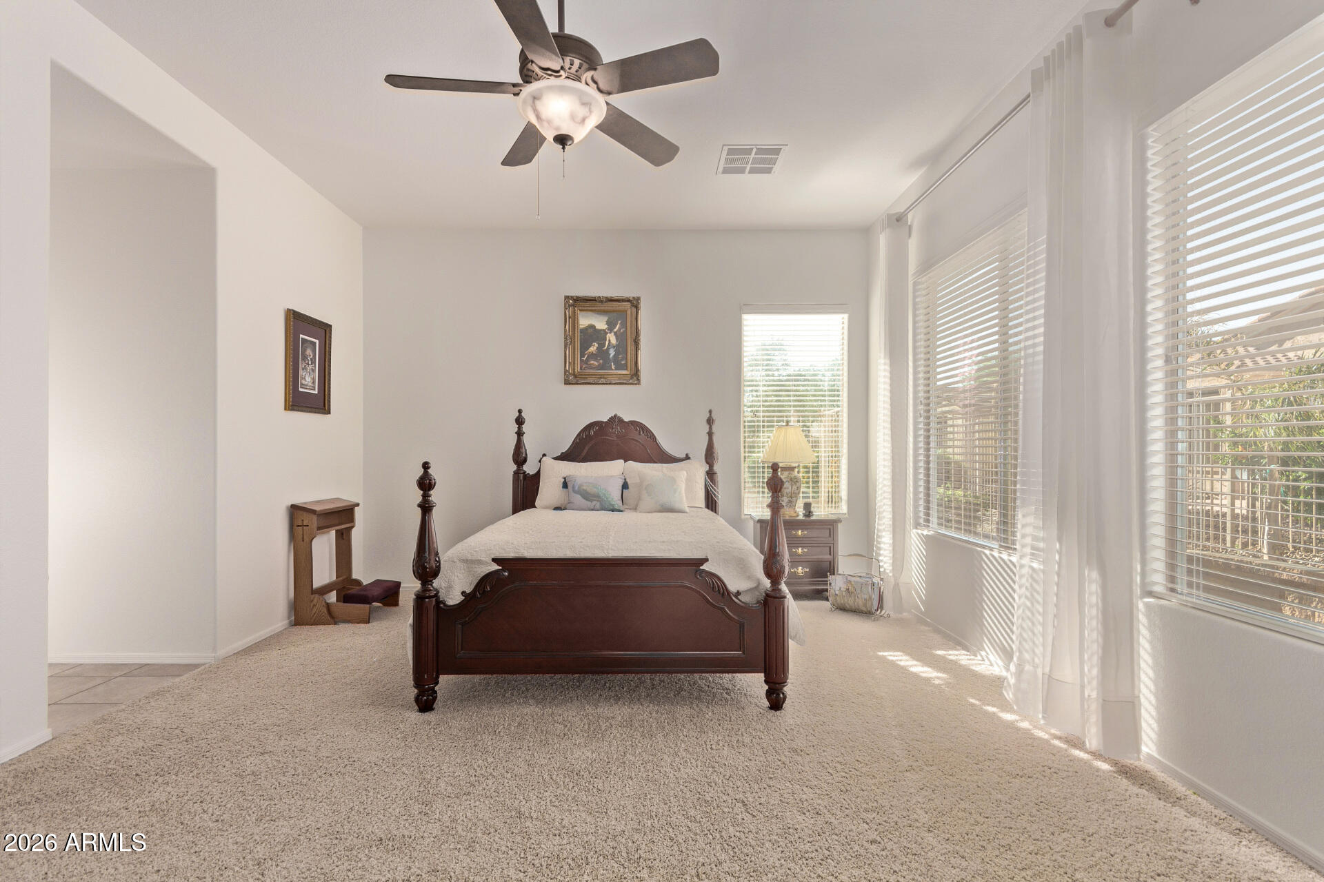 4120 East Jude Lane Gilbert, AZ 85298 - Photo 16 of 61 a spacious bedroom with a bed and a large window