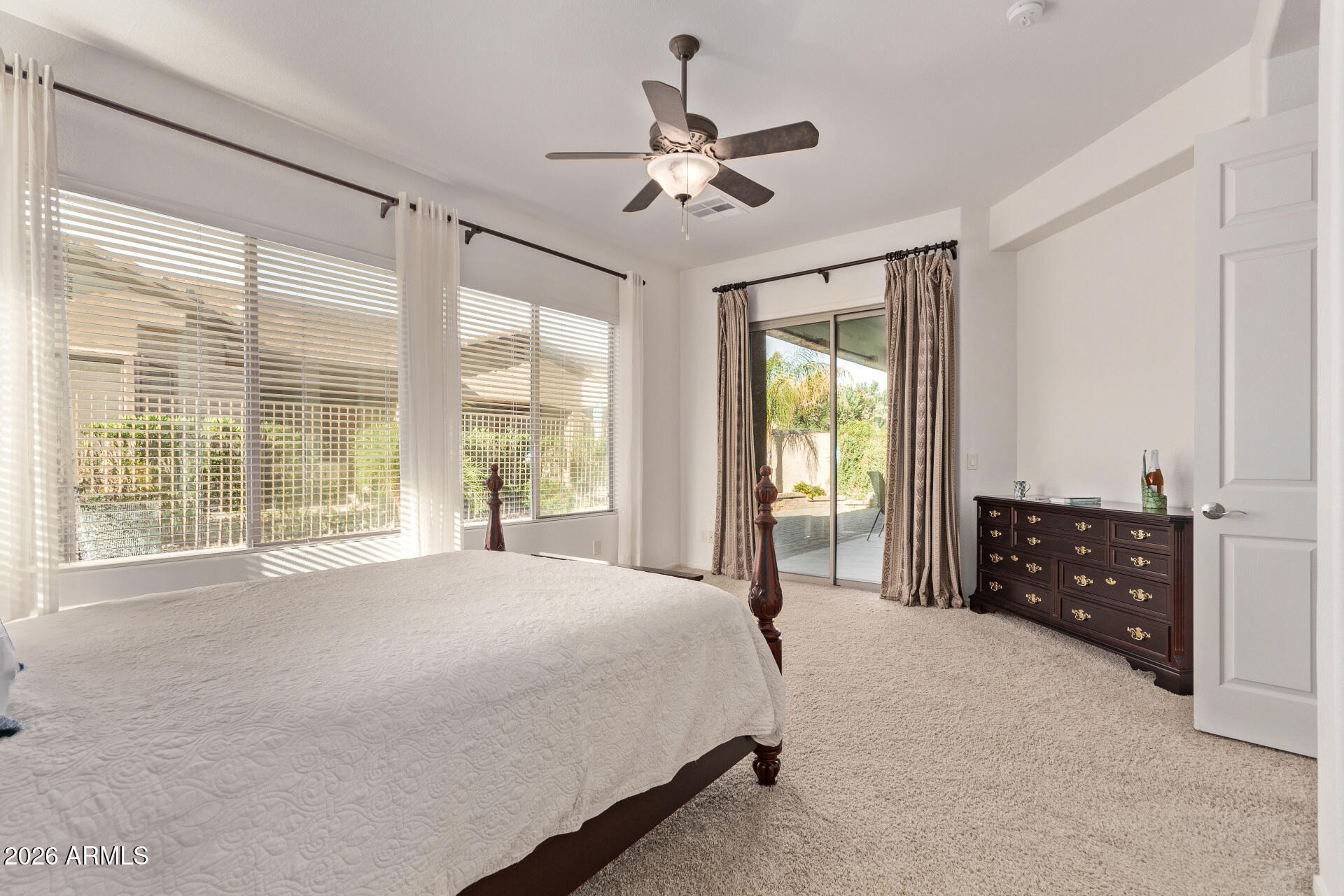 4120 East Jude Lane Gilbert, AZ 85298 - Photo 18 of 61 a spacious bedroom with a large bed and a large window