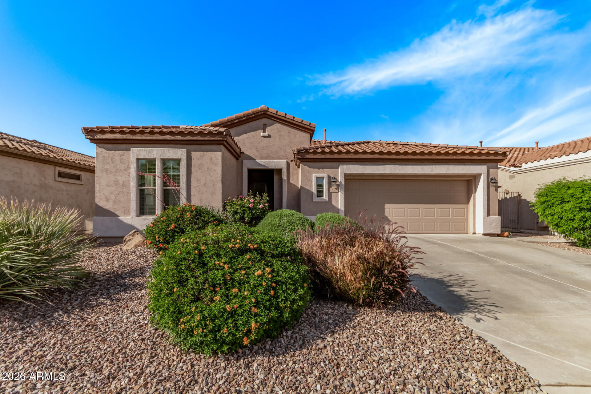 4120 East Jude Lane Gilbert, AZ 85298 - Photo 2 of 61 a front view of a house with a garden