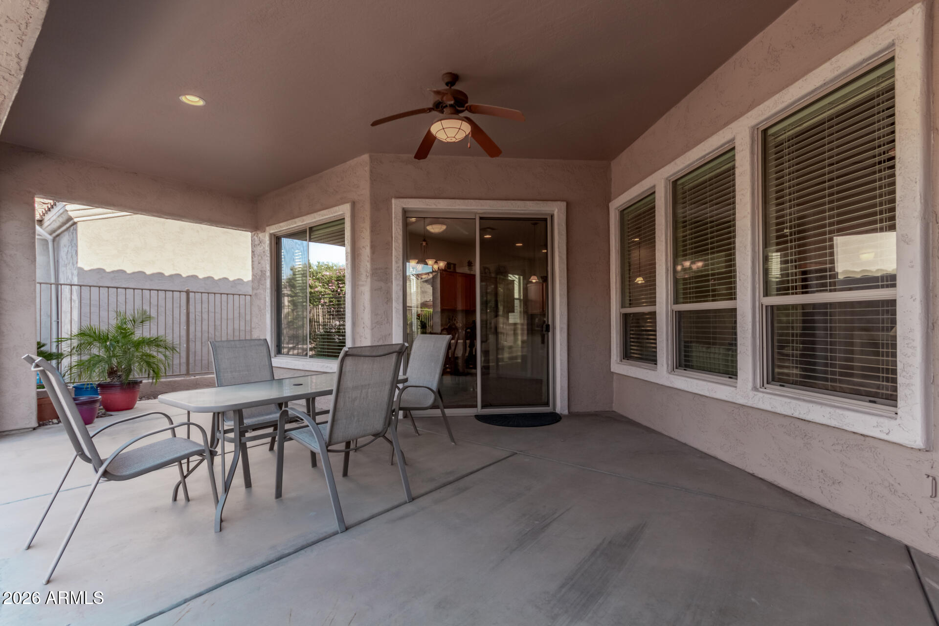 4120 East Jude Lane Gilbert, AZ 85298 - Photo 24 of 61 a view of a patio with a table and chairs and potted plants