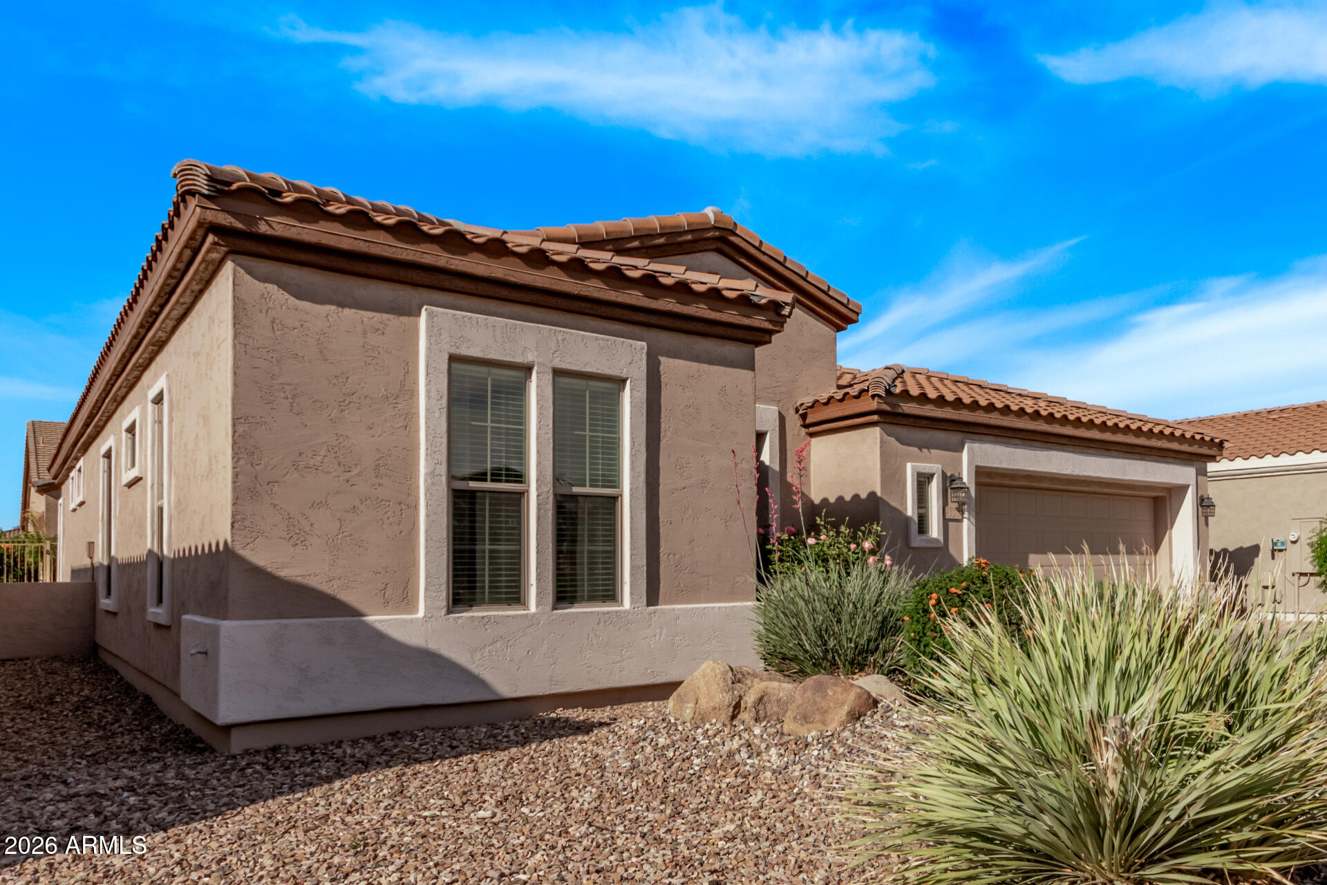 4120 East Jude Lane Gilbert, AZ 85298 - Photo 3 of 61 a view of a house with a small yard and plants