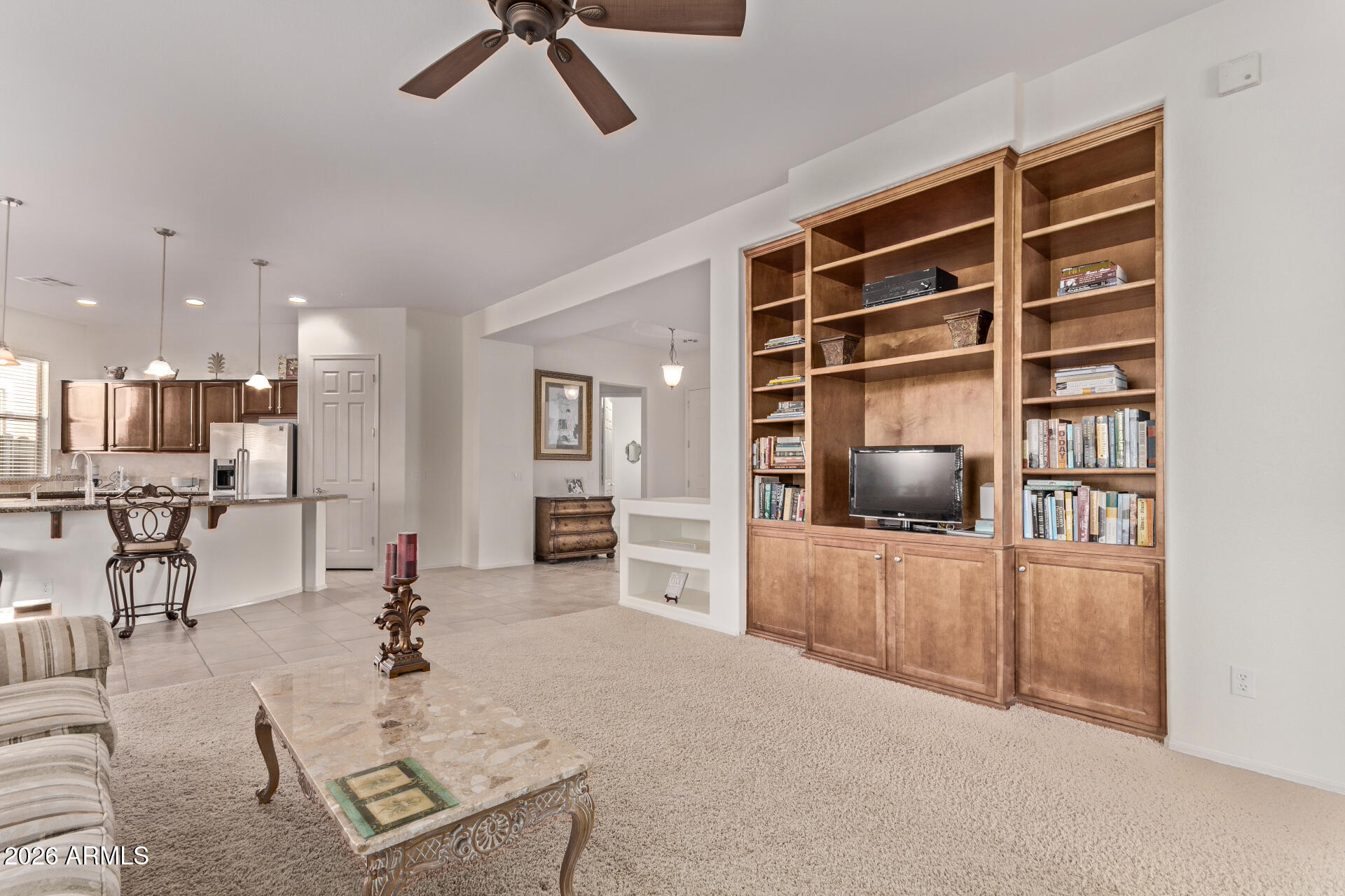 4120 East Jude Lane Gilbert, AZ 85298 - Photo 8 of 61 a living room with furniture and a flat screen tv