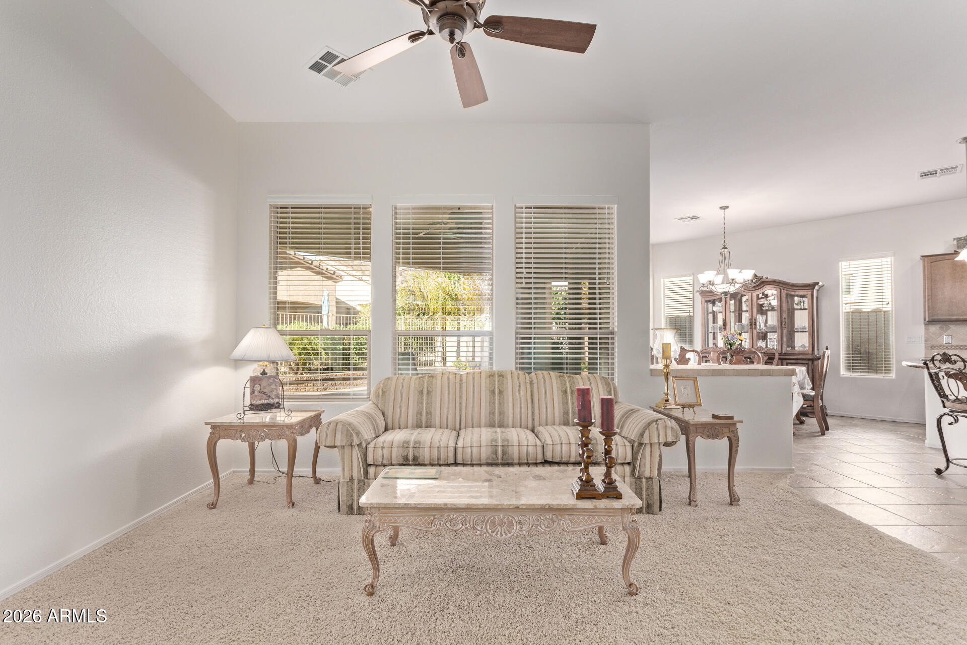 4120 East Jude Lane Gilbert, AZ 85298 - Photo 9 of 61 a living room with furniture and a large window