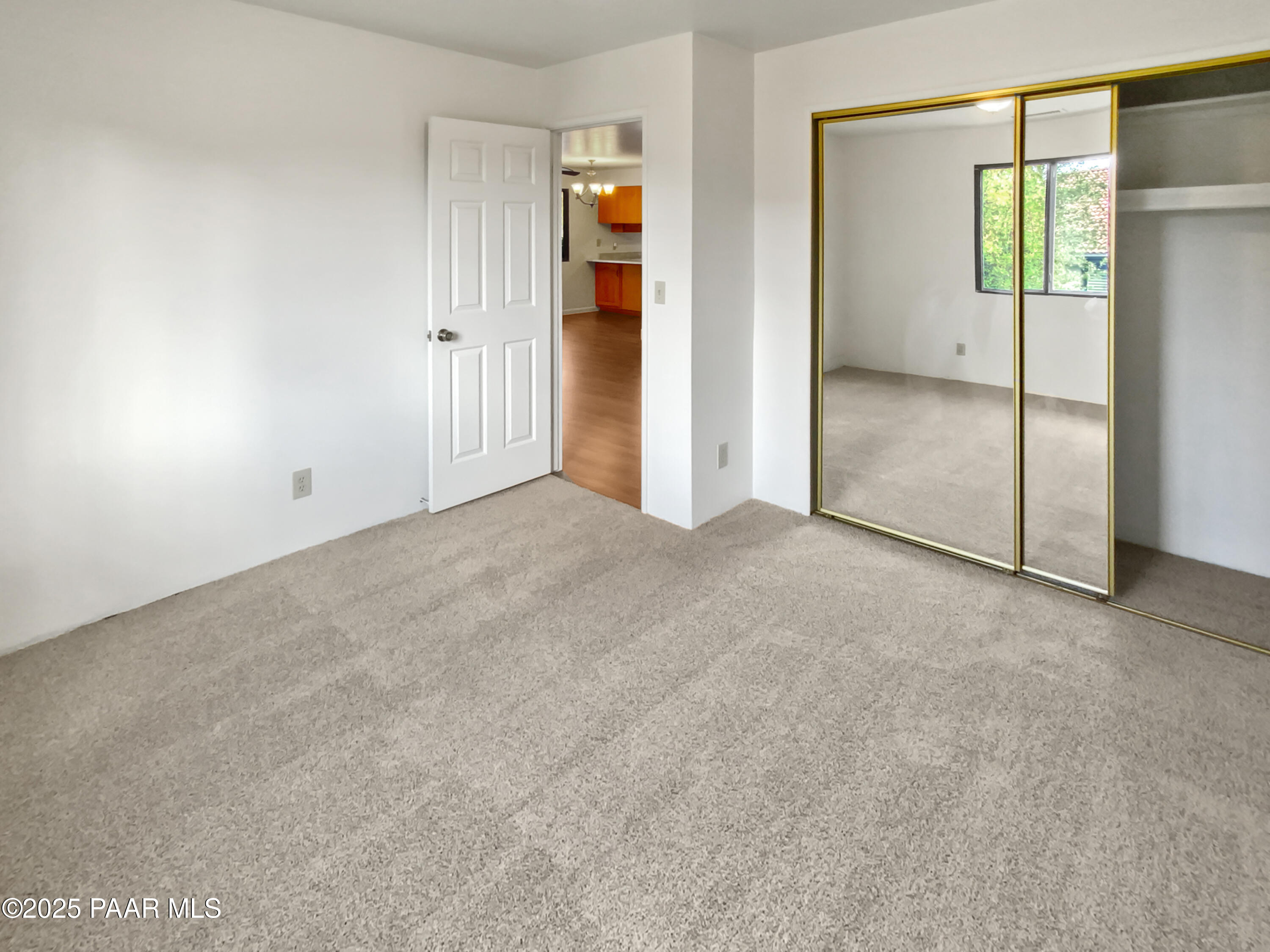 410 Apache Plume Trail Prescott, AZ 86301 - Photo 12 of 22 an empty room with closet and a window