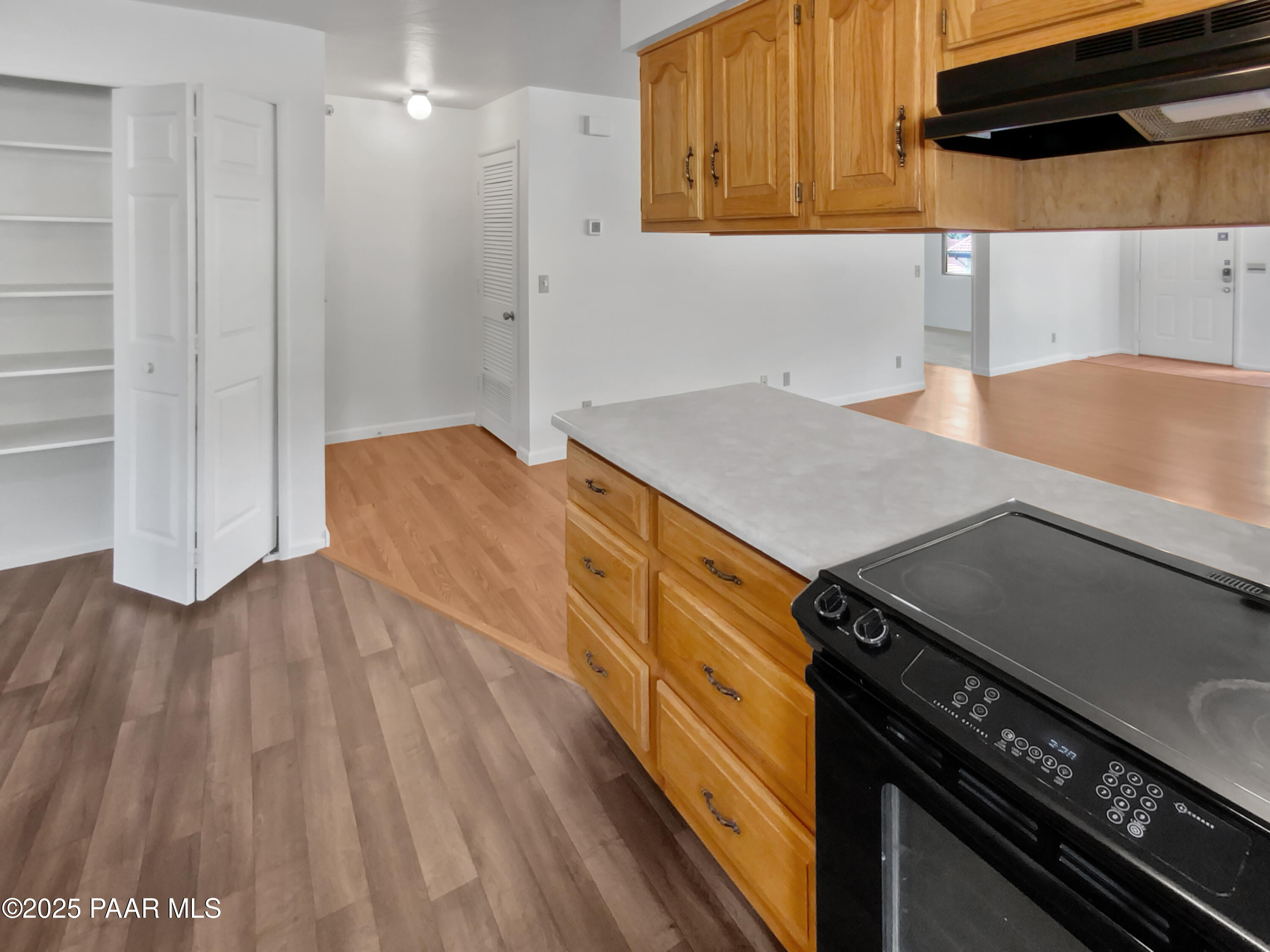 410 Apache Plume Trail Prescott, AZ 86301 - Photo 14 of 22 a kitchen with a stove and a wooden floor