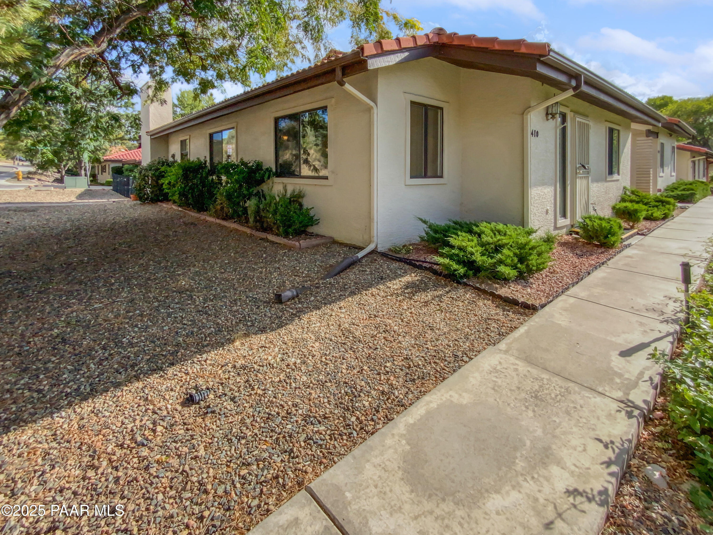 410 Apache Plume Trail Prescott, AZ 86301 - Photo 21 of 22 a front view of a house with garden