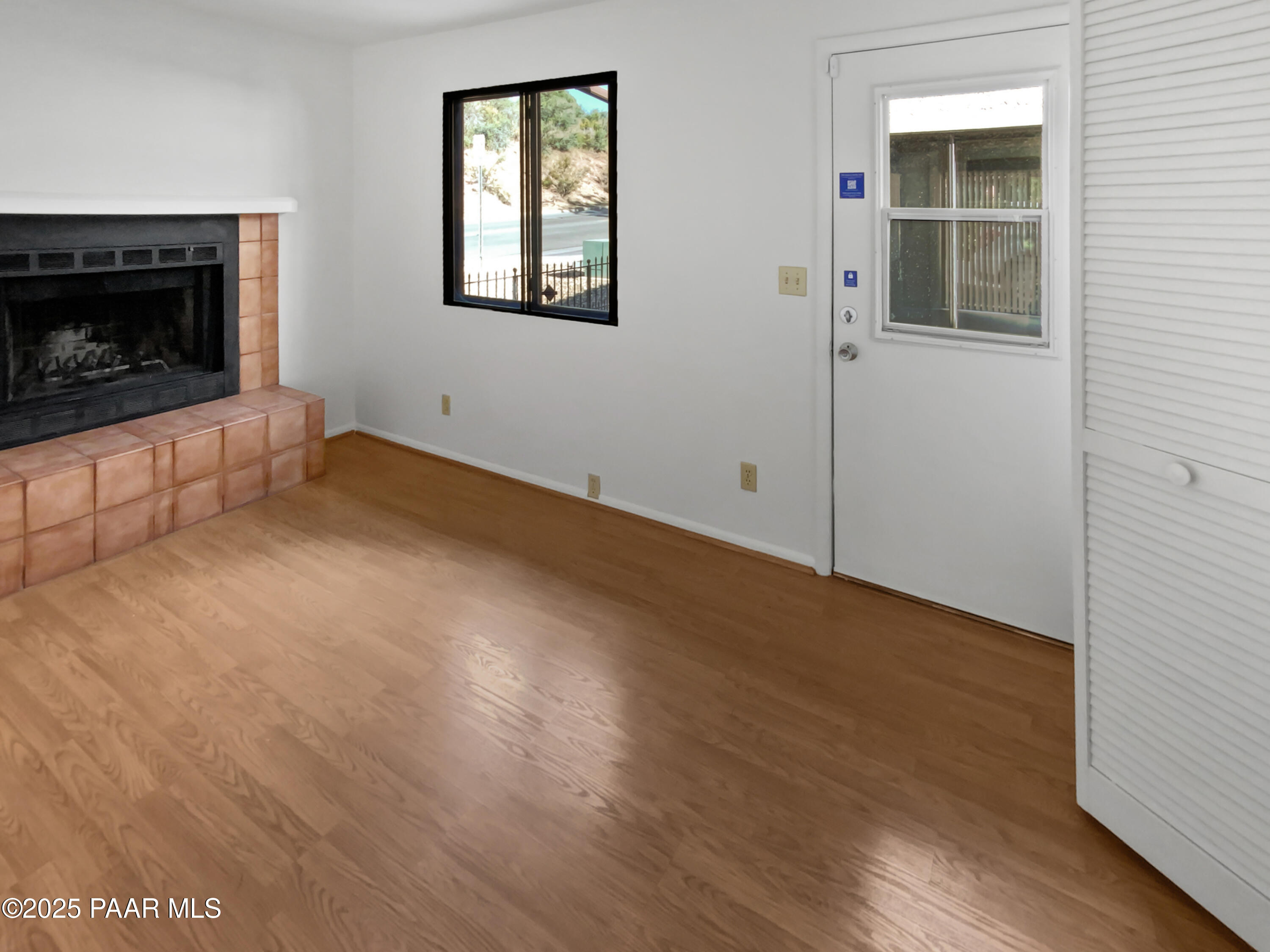 410 Apache Plume Trail Prescott, AZ 86301 - Photo 4 of 22 an empty room with windows and fireplace