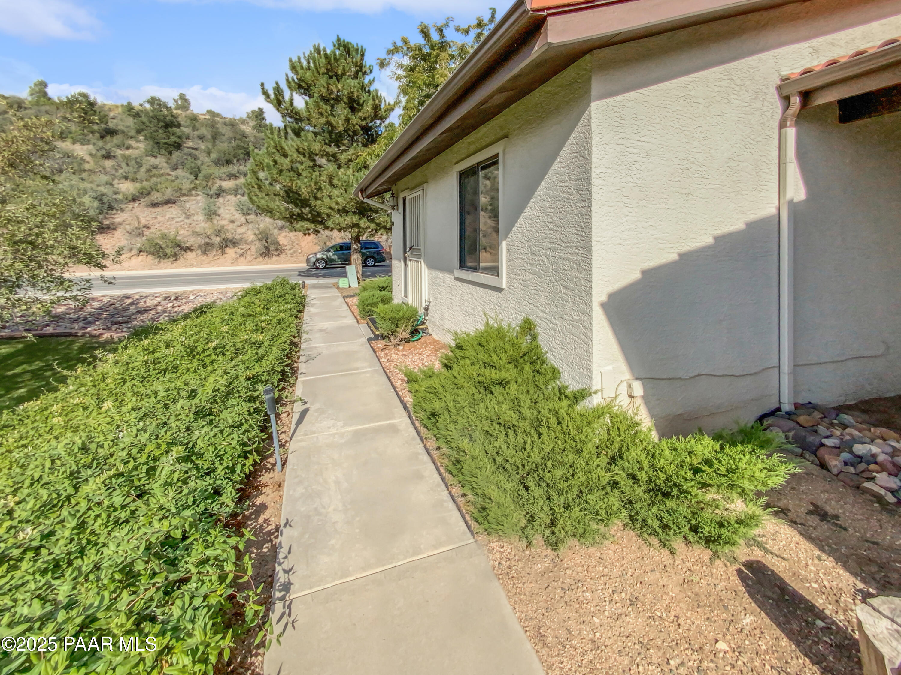 410 Apache Plume Trail Prescott, AZ 86301 - Photo 8 of 22 a view of a pathway with a yard
