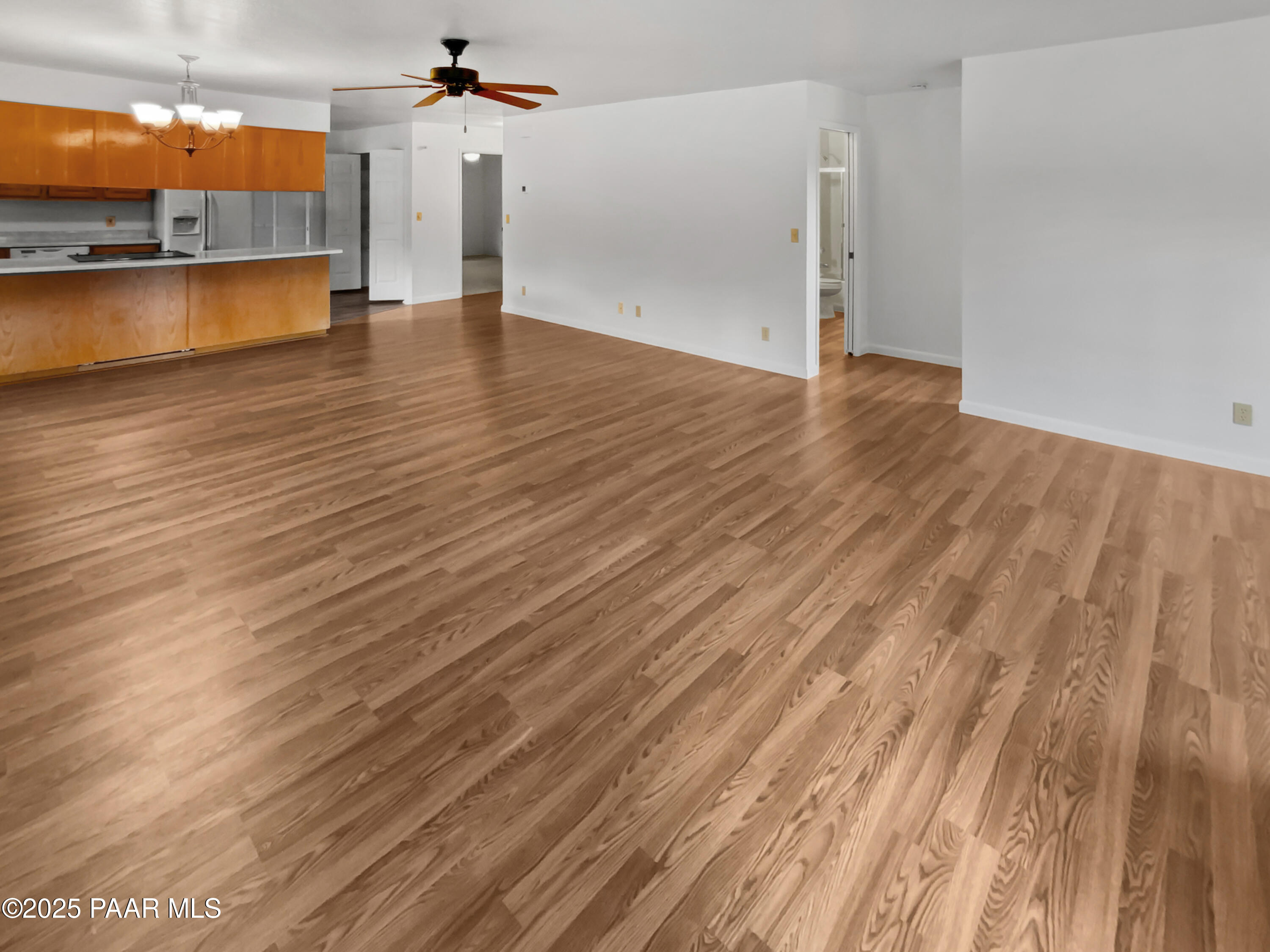 410 Apache Plume Trail Prescott, AZ 86301 - Photo 10 of 22 wooden floor in an empty room with a window