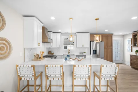 a kitchen with a sink stove and refrigerator