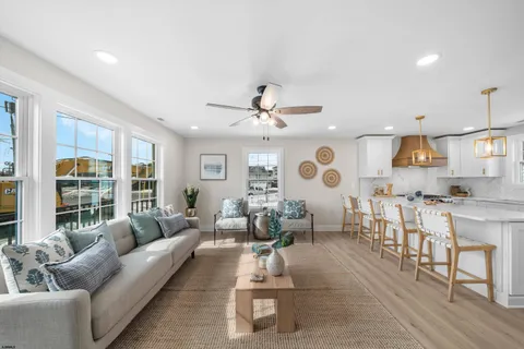 a dinning room with furniture and a wooden floor