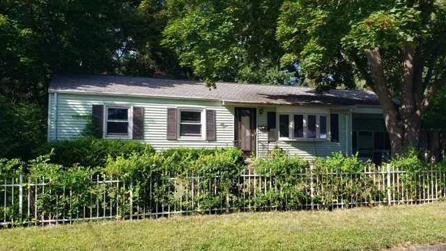 front view of a house with a garden