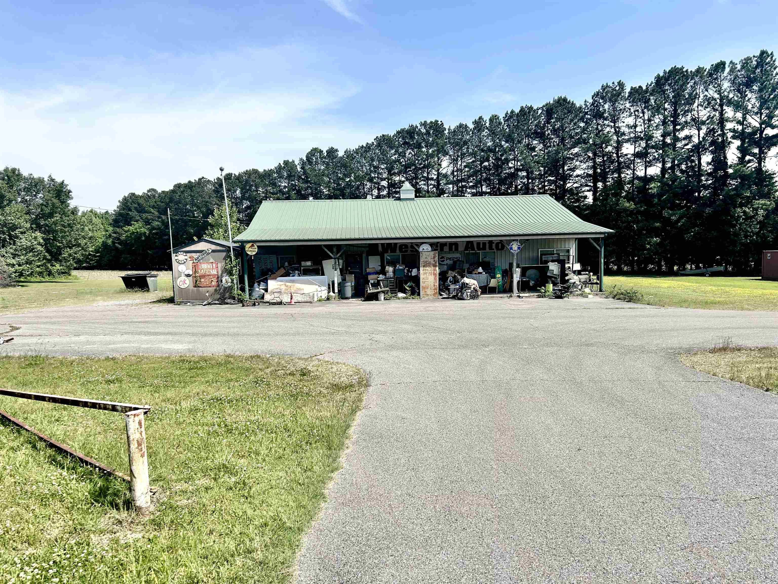 1412 North 51st Highway Ripley, TN 38063 - Photo 1 of 1 a view of a swimming pool and a chairs under an umbrella