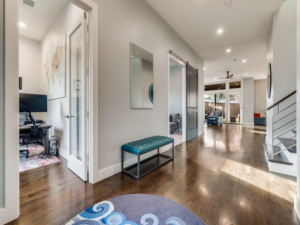 7912 Hanover Street Dallas, TX 75225 - Photo 2 of 25 Hallway featuring recessed lighting, hardwood / wood-style flooring, and a barn door
