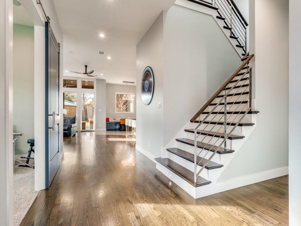 7912 Hanover Street Dallas, TX 75225 - Photo 3 of 25 Stairs with wood finished floors, recessed lighting, a ceiling fan, and a barn door