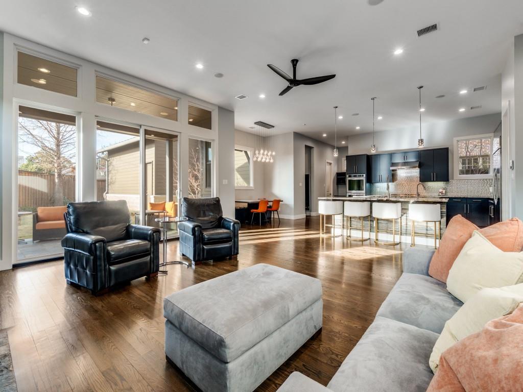 7912 Hanover Street Dallas, TX 75225 - Photo 7 of 25 Living room featuring dark wood-type flooring, ceiling fan, and suspended lighting