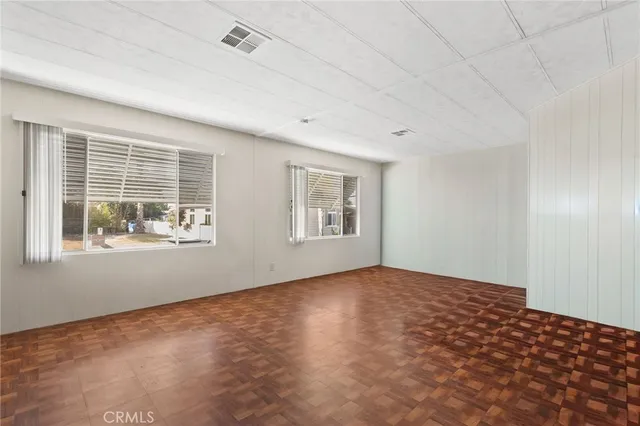 a kitchen with cabinets appliances a sink and a counter top space