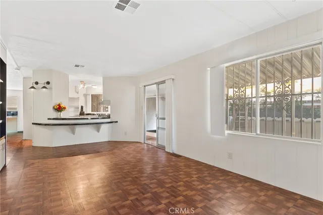 a view of kitchen and wooden floor