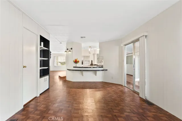 a bedroom with a large bed and a flat screen tv