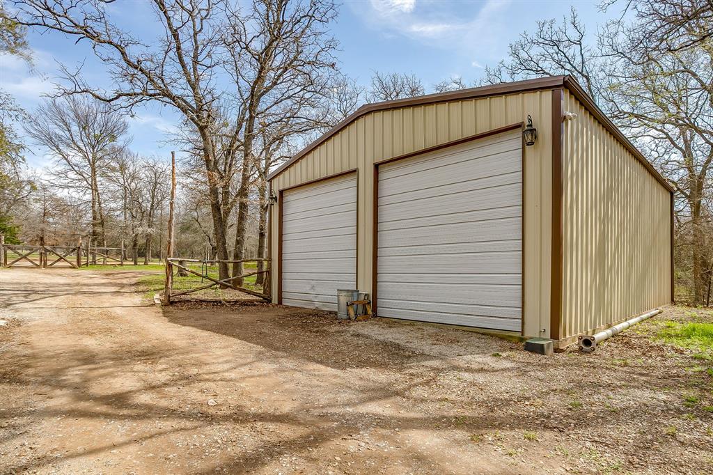 1615 Sanger Drive Springtown, TX 76082 - Photo 33 of 40 a view of a house with backyard and trees