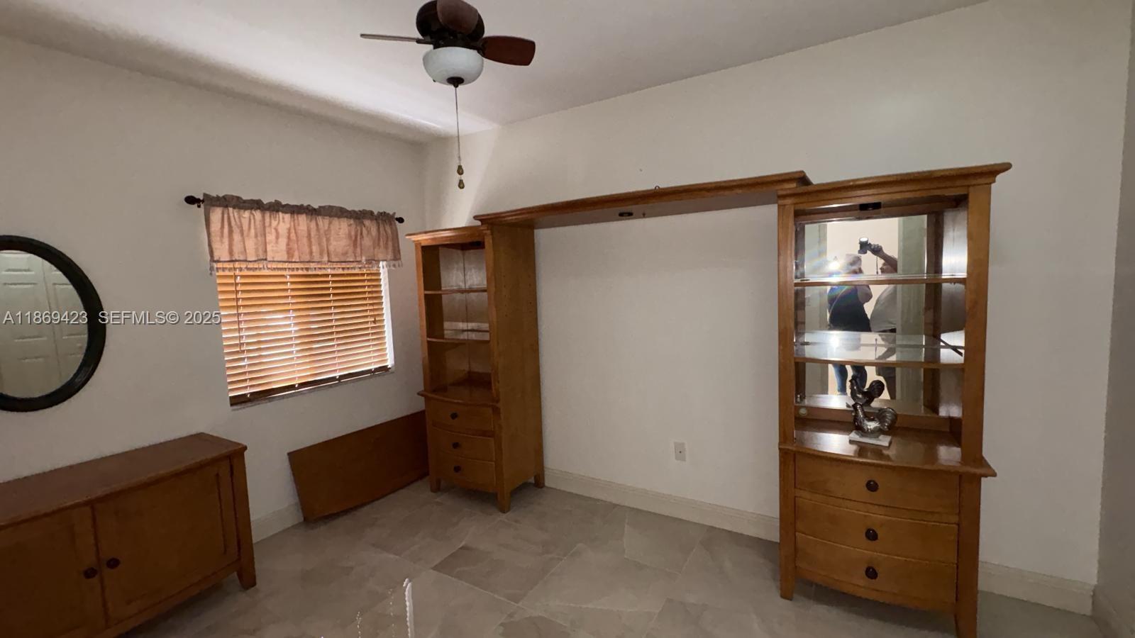 3279 Northeast 11th Drive Homestead, FL 33033 - Photo 12 of 15 a room with window and cabinet