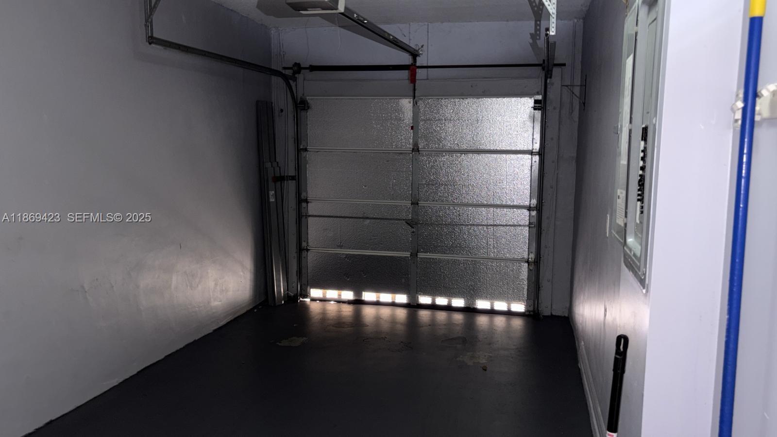 3279 Northeast 11th Drive Homestead, FL 33033 - Photo 13 of 15 a view of water heater room with wooden floor