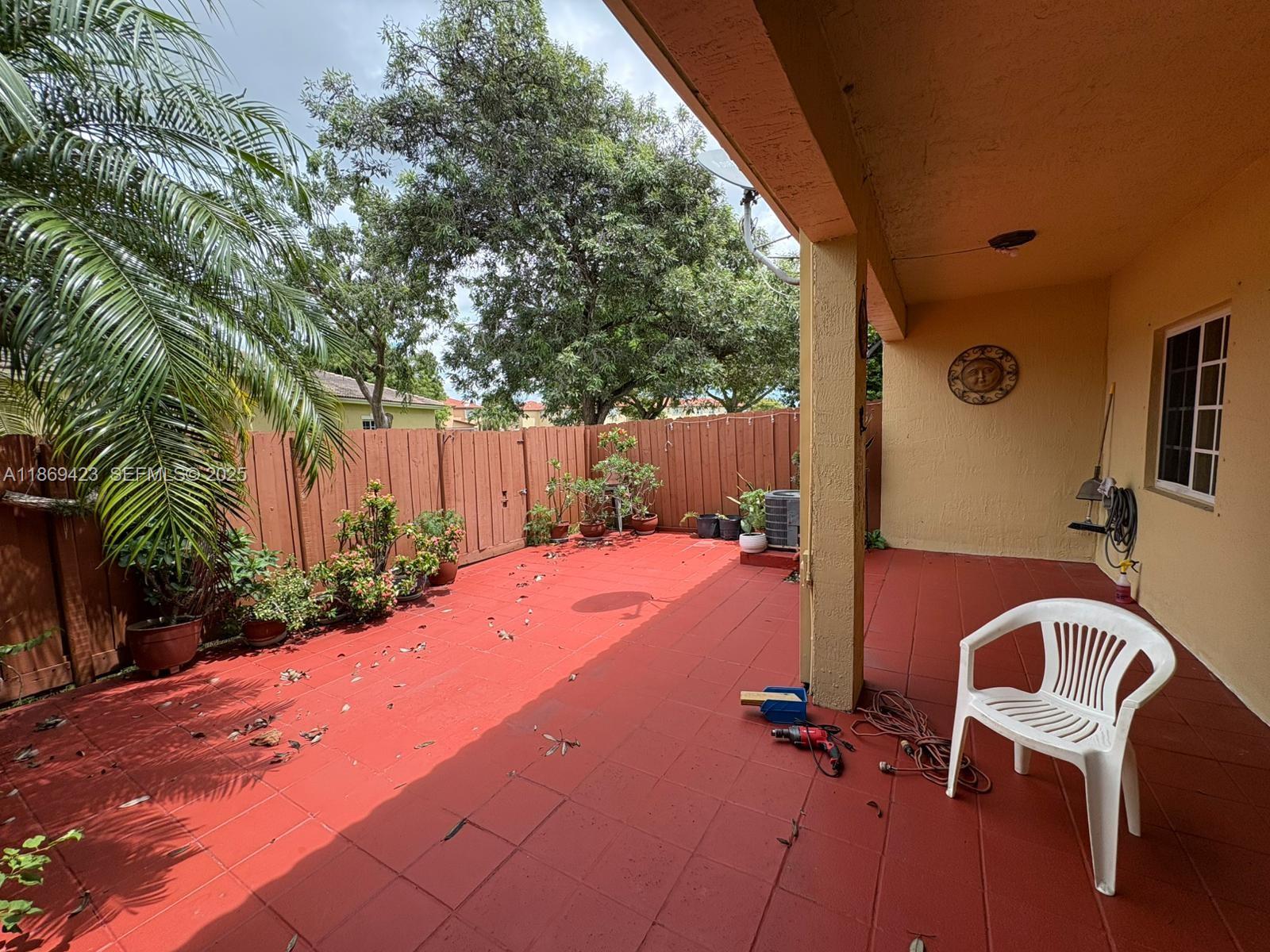 3279 Northeast 11th Drive Homestead, FL 33033 - Photo 15 of 15 a backyard of a house with table and chairs