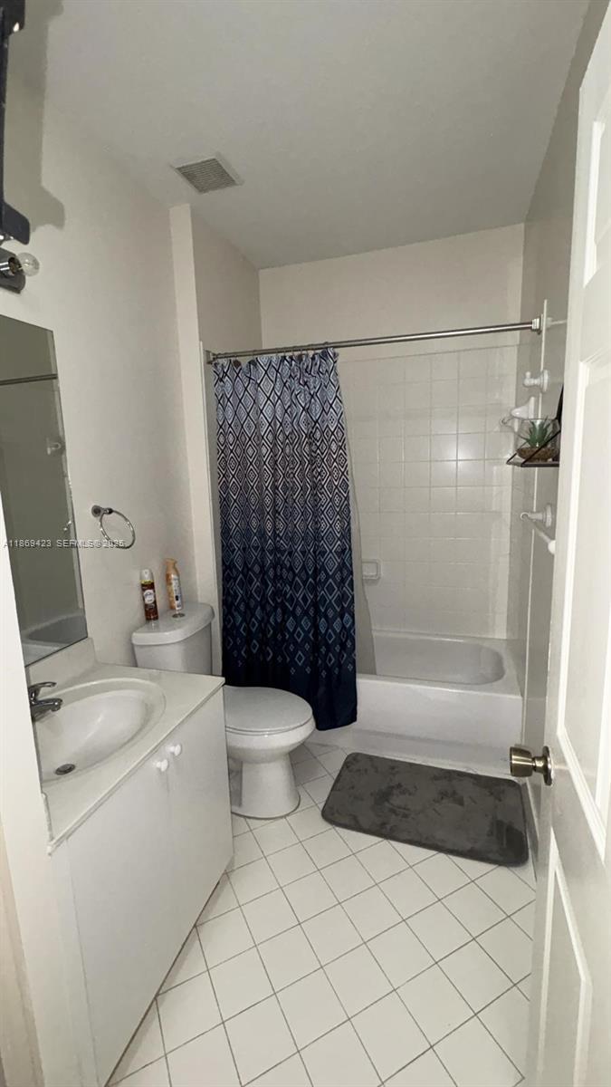 3279 Northeast 11th Drive Homestead, FL 33033 - Photo 8 of 15 a bathroom with a toilet and a shower