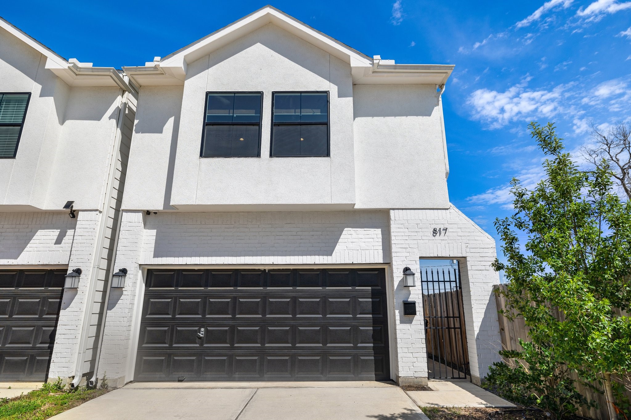a front view of a house with a garage