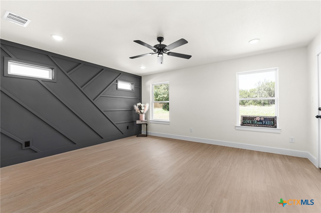 3025 Millhouse Road Copperas Cove, TX 76522 - Photo 13 of 38 an empty room with windows and fan