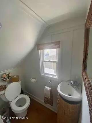 a bathroom with a toilet and a sink