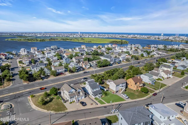 an aerial view of a balcony with chairs