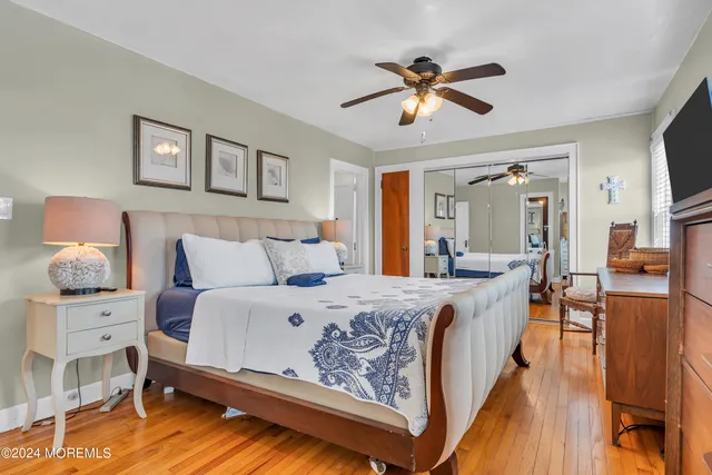 a bed room with a bed and a chandelier