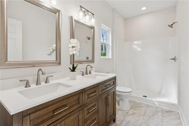 a bathroom with a toilet and shower