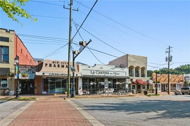 a view of a building with backyard porch and sitting area