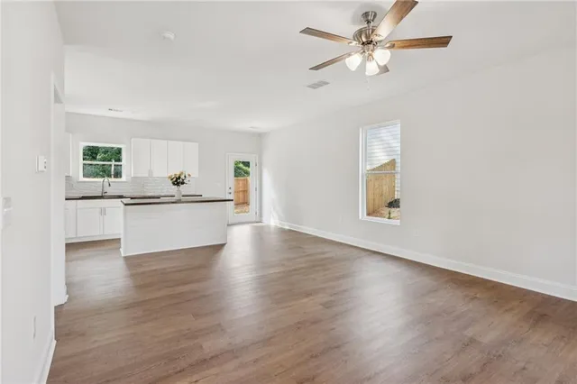 a view of a kitchen with a sink and a window