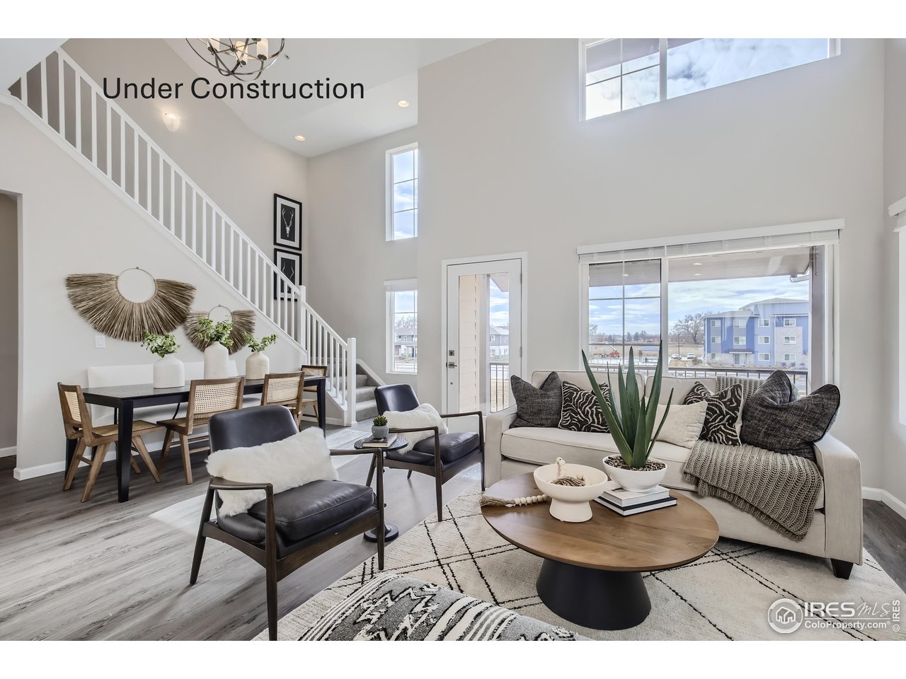 1002 Collamer Drive, Unit 8 Fort Collins, CO 80524 - Photo 11 of 39 a living room with furniture and a large window