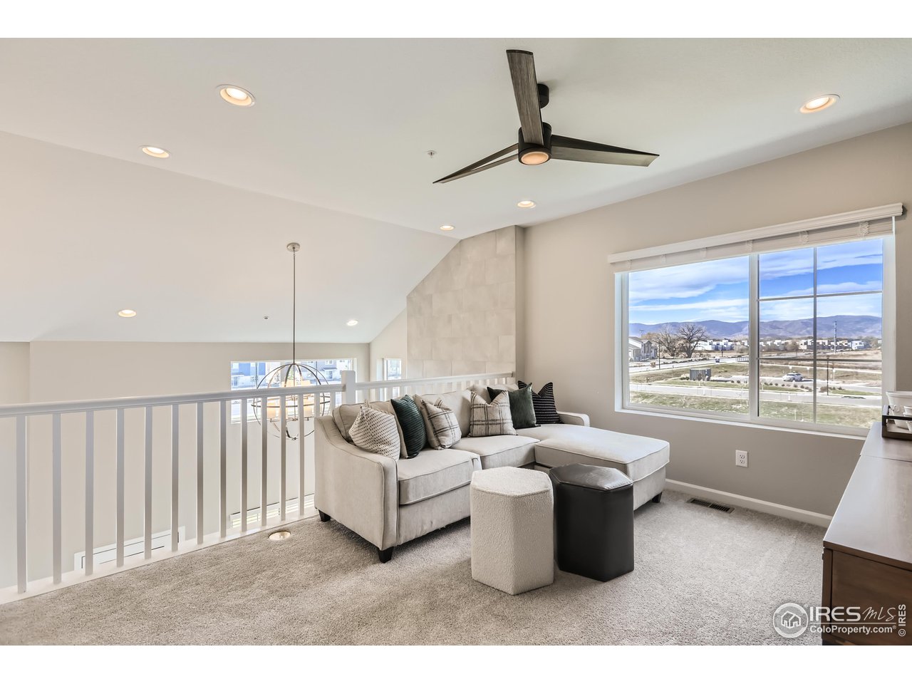 1002 Collamer Drive, Unit 8 Fort Collins, CO 80524 - Photo 21 of 39 a living room with furniture and a large window